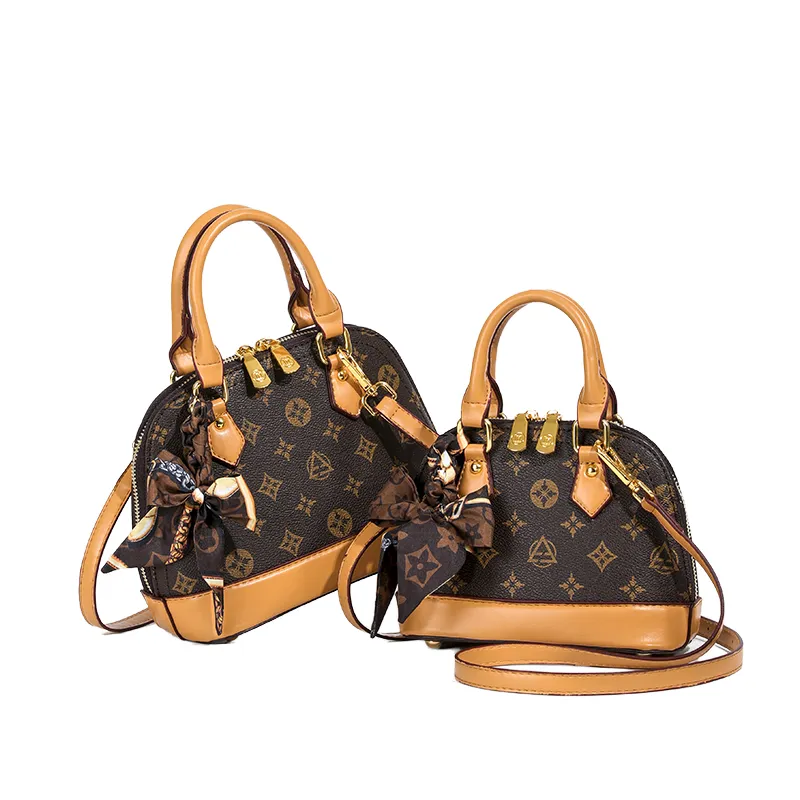 Sac à main de luxe pour femme en cuir véritable, forme coquillage, bandoulière unique, motif géométrique rétro , collection 2026